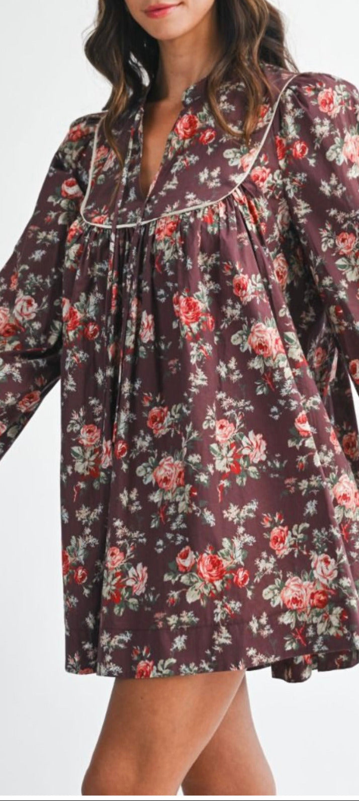 Woman wearing a floral dress with a white background