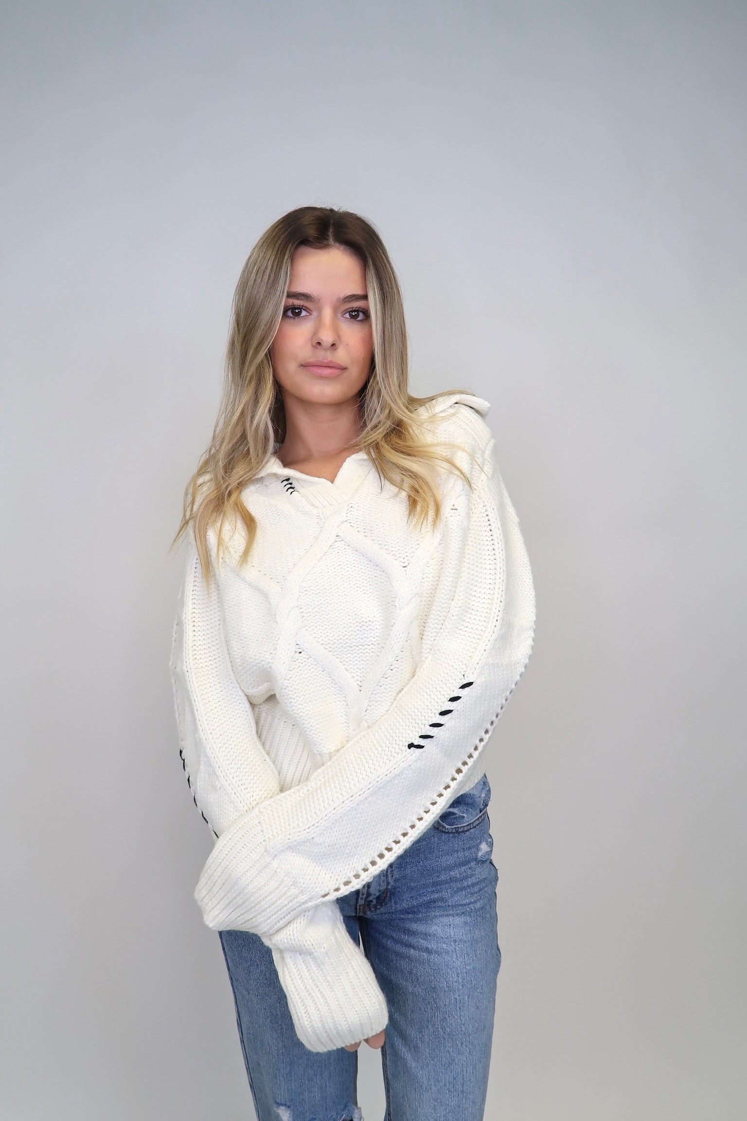 ALL STITCHED UP SWEATER